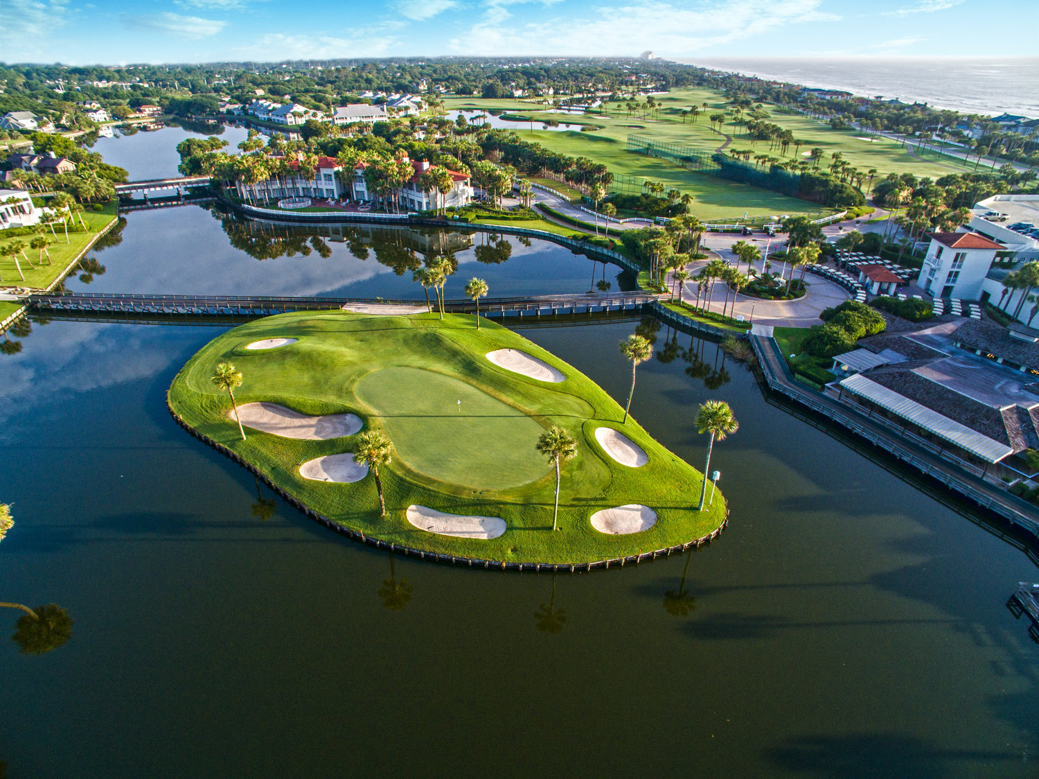 Florida coastal golf course with palm trees at golden hour