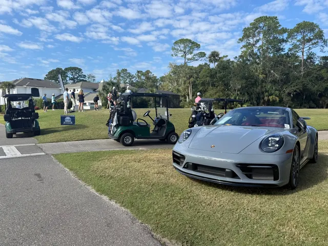 Porsche hole-in-one prize car on the tee box